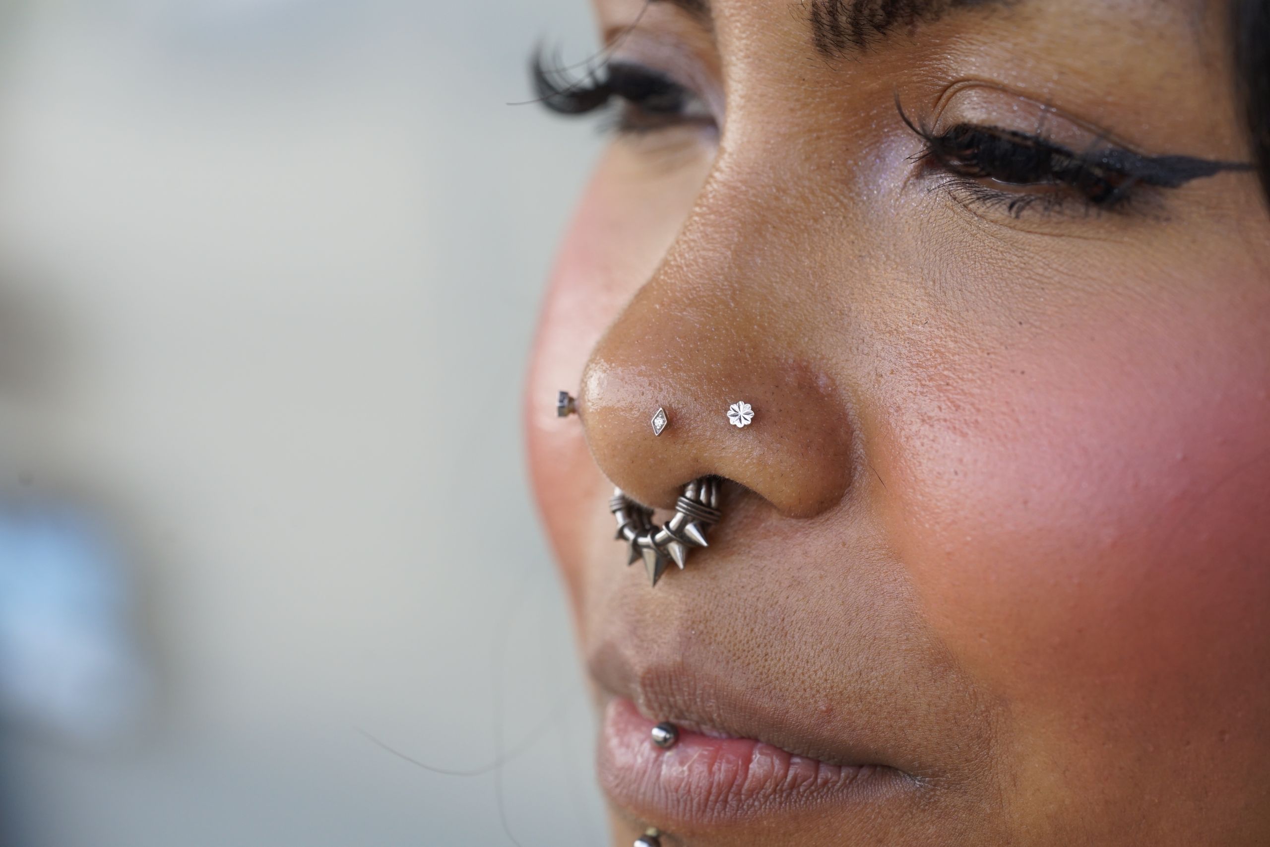 An example of a nose and mouth piercing set An example of a nose and mouth piercing set